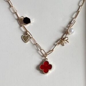 Gold Necklace with Red and Black Charms